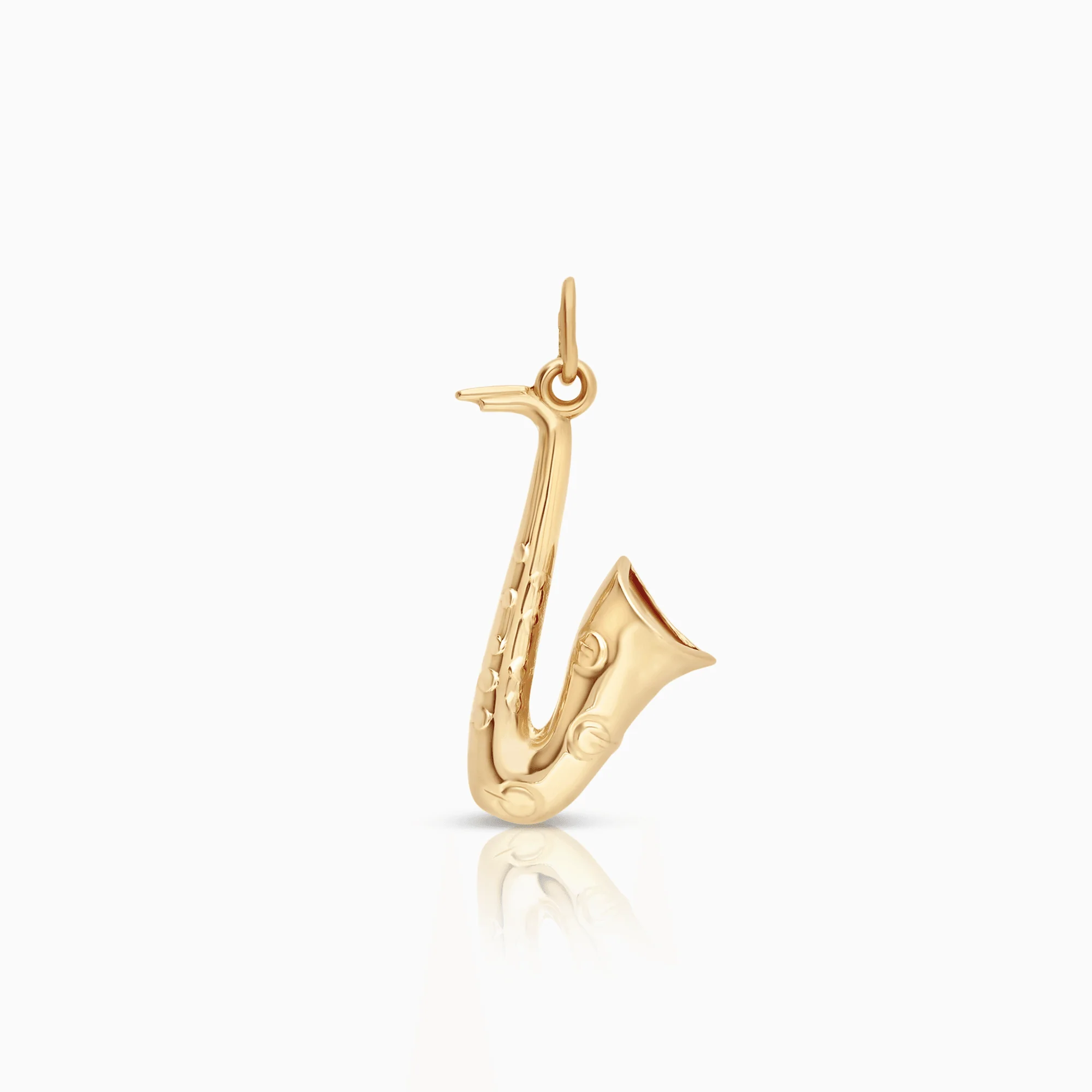 Pendant saxophone 1.04g 18K gold